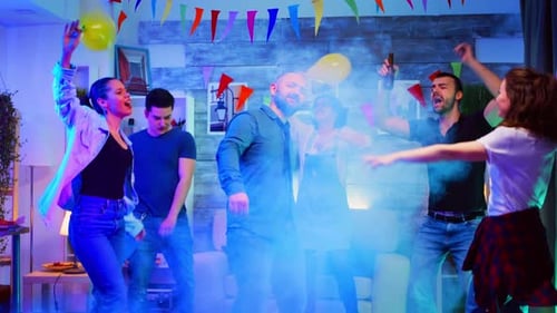 Enthusiastic Young Adults Dancing and Celebrating