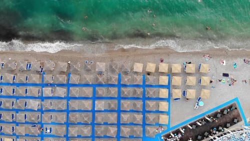 Coastal Beach with Umbrellas Aerial Birds Eye View