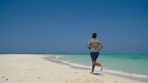 Man Running on the Beach