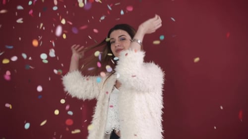 Woman Celebrates Birthday with Confetti and Enthusiasm