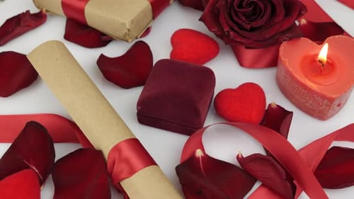 Valentines Day gift present. Red box with wedding ring. Romantic proposal at St. Valentine's Day