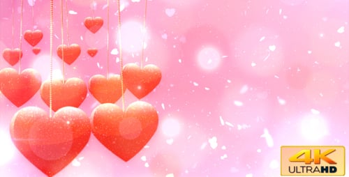 Romantic Hanging Hearts Animation with Shimmering Particles Background