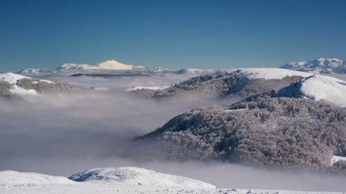 Snowy Mountains and Clouds