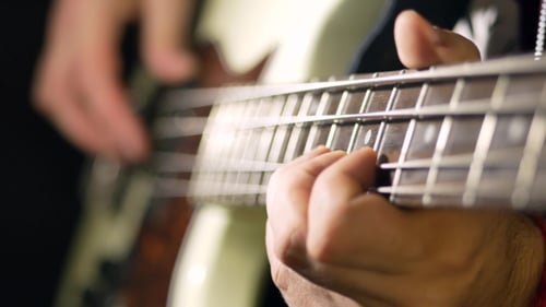 Close Up of Bass Guitar Being Played