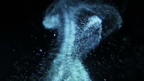 Dynamic Blue Particle Stream Floating Fluidly in Dark Space