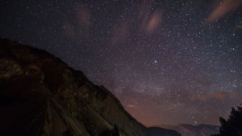 of Stars Moving Above a Mountain