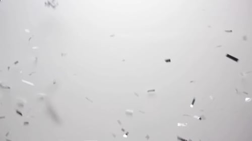 Silver Confetti Falling Over White Background 2