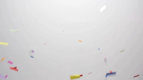 Colorful Confetti Swirls Across Bright Background