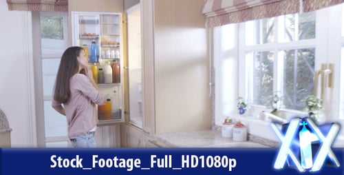 Woman Eats Green Apple in Modern Kitchen