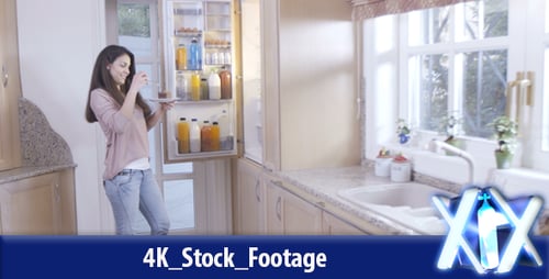 Woman Eating Cake From the Refrigerator