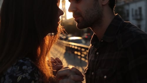 Romantic Couple Kissing at Sunset