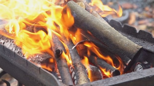 Burning Wood in a Barbecue Fire Pit