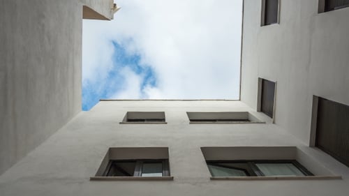 Inside Close Yard. Look at Up. Bottom View. Fast Clouds. .