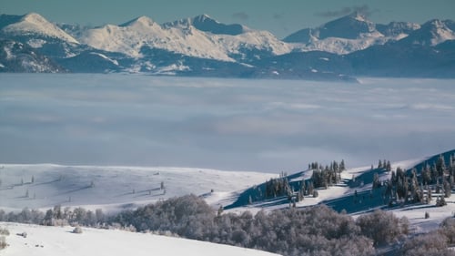 Snowy Mountains and Clouds
