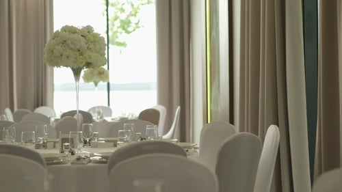 Elegant Wedding Reception Hall with Floral Centerpieces