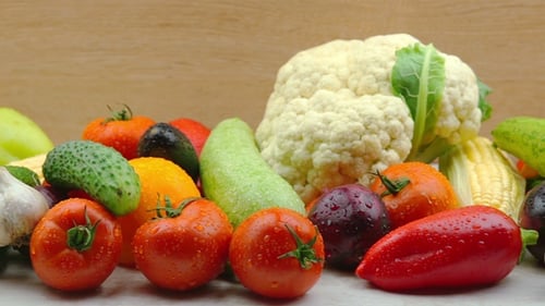 Colorful Fresh Vegetables Rotating with Water Droplets