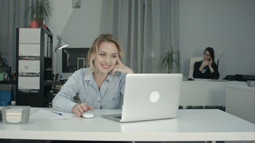 Young Female Worker Making Video Call Via Laptop in the Office