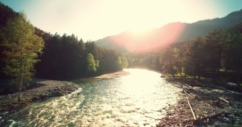 Low Flight Over Fresh Cold Mountain River at Sunny Summer Morning.