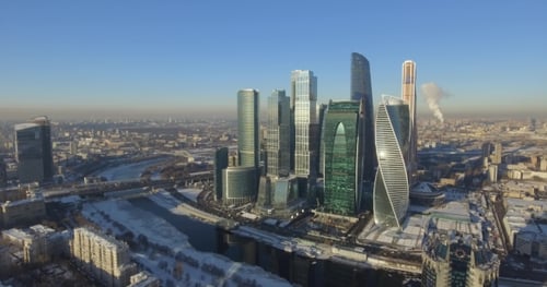 Business Center Moscow City in the Winter Day Aerial Flight Around the Skyscraper on Drones