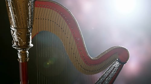 Elegant Golden Harp Rotating with Stage Lighting