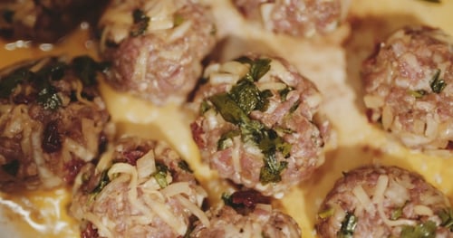 Raw Meatballs Seasoned with Herbs and Onions