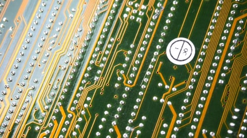 Detailed Circuit Board Close-Up with Gold Lines