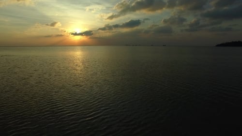 Aerial View of Sunset. Flying Over the Sea