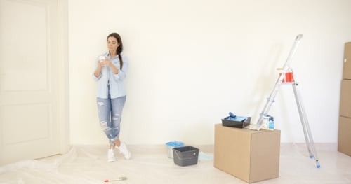 Woman on Phone Planning Home Renovation