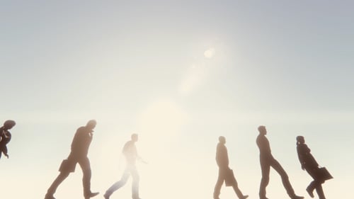 Animated Silhouettes of Business People Walking Towards Bright Light
