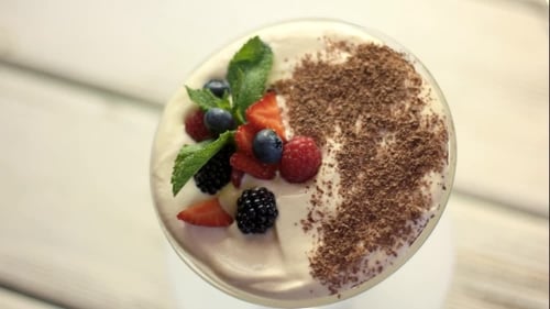 Delicious Dessert with Berries and Chocolate Shavings