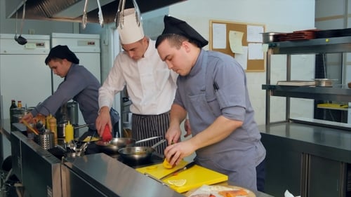Chefs Preparing Food in a Commercial Kitchen