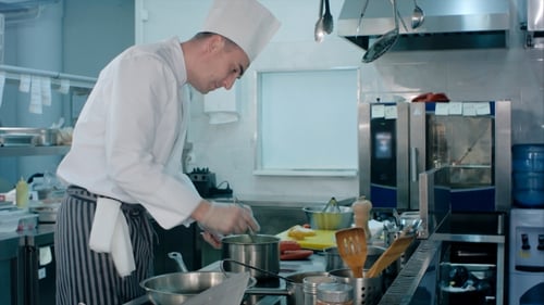Chef Prepares Food in Commercial Kitchen