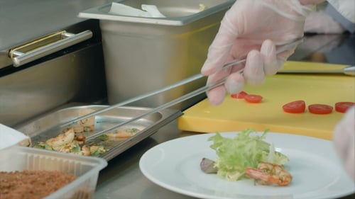 Chef Prepares Elegant Seafood Salad in Kitchen