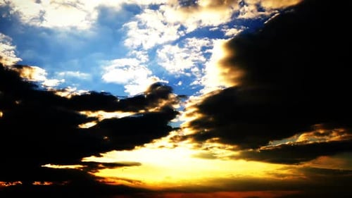 Golden Sunrise Shines Through Dramatic Cloudscape