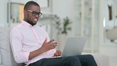 Smiling Man on Laptop Having a Video Call