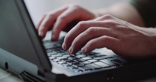 Business - Businessman Hands Type on Laptop Computer Close Up
