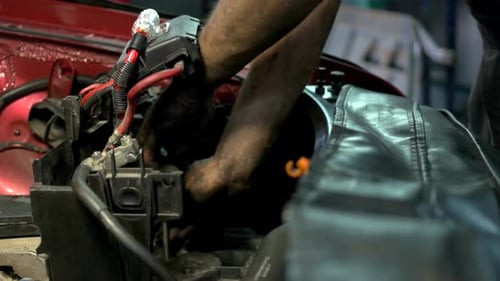 Close Up Mechanic Screwing Car Engine Mechanism