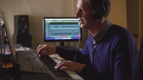 People in the Studio Emotionally Composes and Records Music