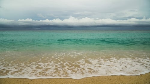 Beautiful Beach on Tropical Island in Stormy Weather