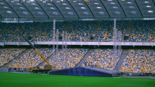 View on the Football Stadium with Workers.