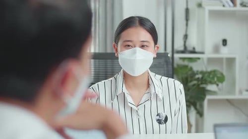 Woman Wearing Mask at Office Meeting