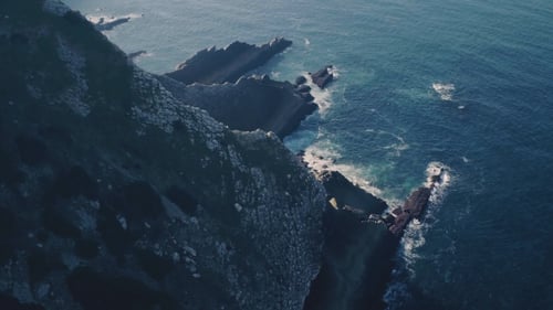 Flight Above Sharp Cliff in Ocean