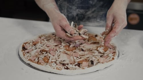 Chef Making a Pizza in Modern Italian Restaurant