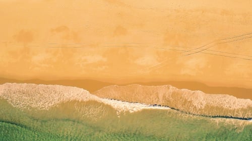 Aerial View Small Waves on Sandy Beach