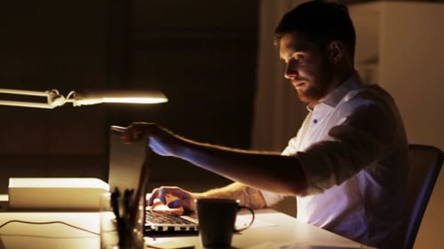 Man Closing Laptop and Leaving Night Office 90