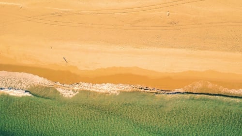 Aerial View Small Waves on Sandy Beach