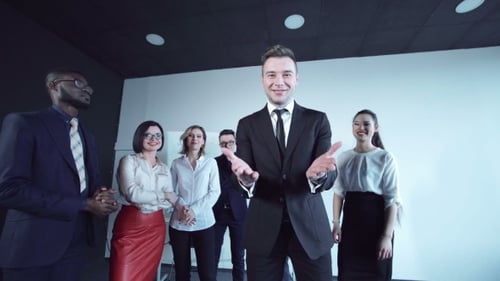Emotional Businessman Rejoices at Camera