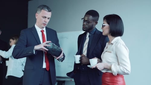 Businessman Explaining How To Use Vr Headset