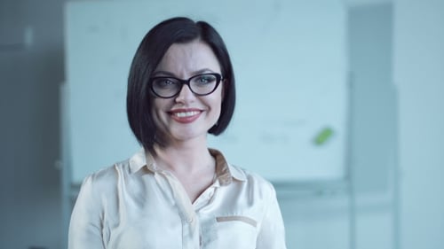 Professional Woman Smiling in Office Environment