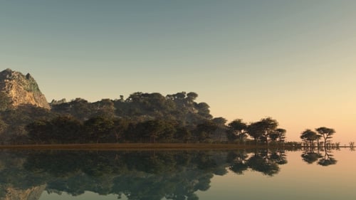 Sonnenuntergang und Insel mit Wald am Meer